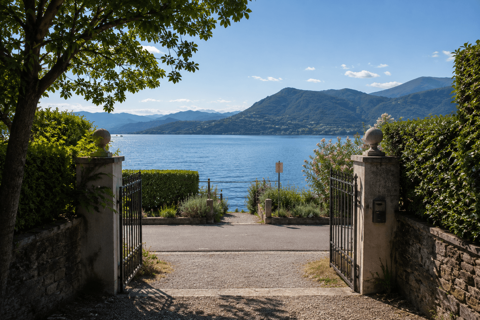 Open gates framing the path toward the lake